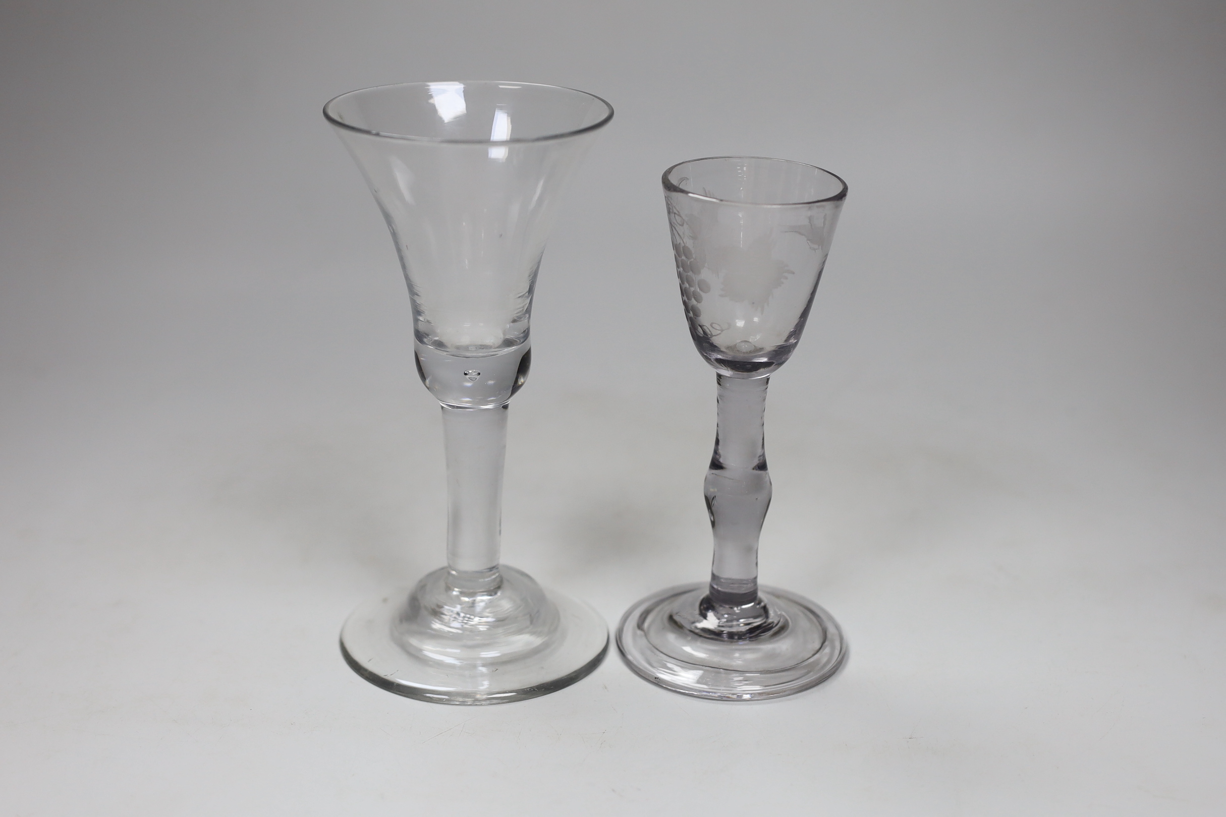 A George II wine glass, domed foot and a George II wine glass, folded foot, largest 16.5cm high